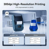 Niimbot M2 Smart Label Printer showcasing 300dpi HD printing clarity comparison with standard labels.