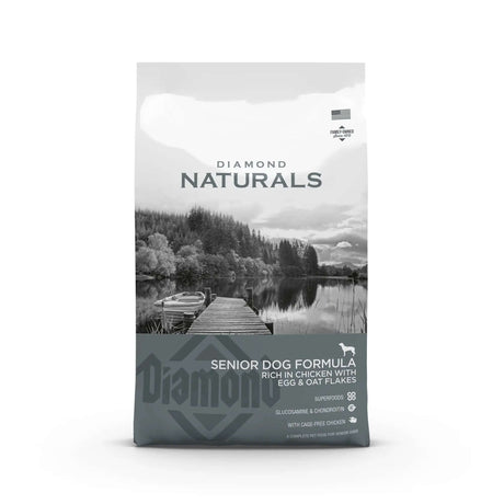 Diamond Naturals Senior Dog Formula Rich in Chicken with Eggs and Oat Flakes Dry Dog Food bag on a scenic background.