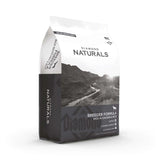 Diamond Naturals Breeder Formula Rich in Chicken and Rice Dry Dog Food bag packaging with scenic background.