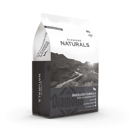 Diamond Naturals Breeder Formula Rich in Chicken and Rice Dry Dog Food bag packaging with scenic background.
