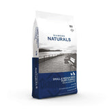 Diamond Naturals Small and Medium Breed Puppy Formula Rich in Chicken and Rice Dry Dog Food packaging on a scenic background.