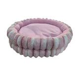 Plush Sleeper Fur Pod pet bed in soft pink, cozy round design for cats and small to medium-sized dogs.