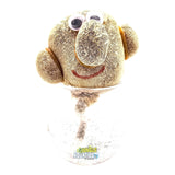 Growing Grass Heads in a jar with googly eyes and a smiling face design, ready to grow grass.