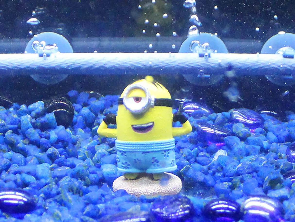 Penn-Plax Minions Officially Licensed Kevin minion figure in aquarium with blue gravel and bubbles.