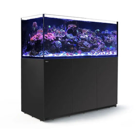 Stunning Red Sea Reefer G2+ 750 aquarium with vibrant coral and fish against a sleek black cabinet design.