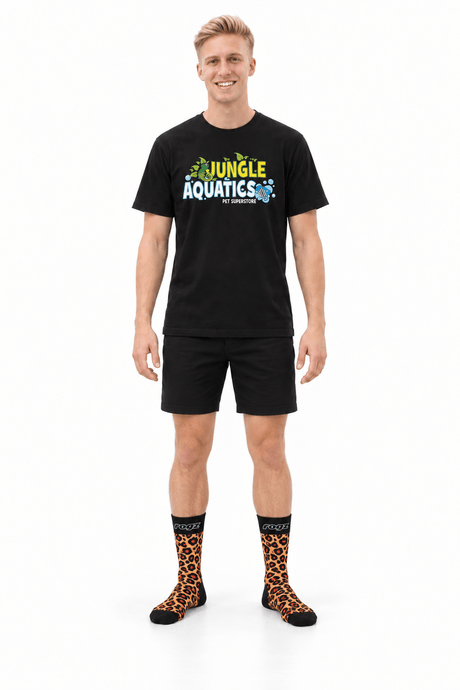 Man wearing Rogz x Versus Safari Socks in Leopard print, black shirt, shorts, ready for a pet walk.