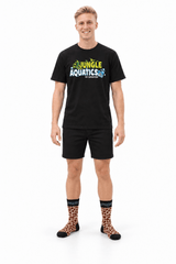 Model wearing Rogz x Versus Safari Socks in Giraffe print, showcasing fun pet-and-owner style.