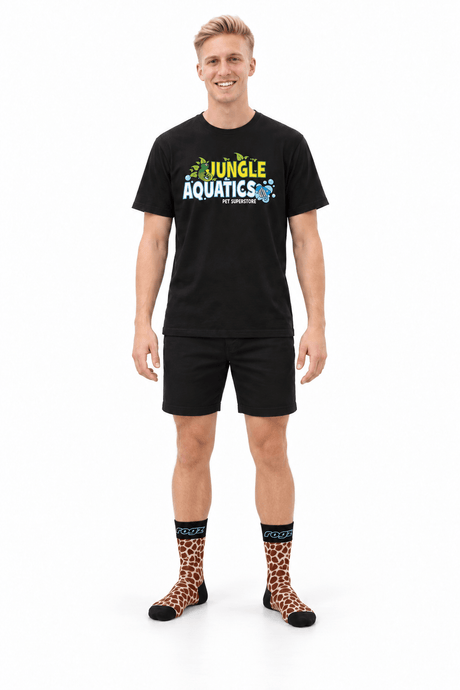Model wearing Rogz x Versus Safari Socks in Giraffe print, showcasing fun pet-and-owner style.