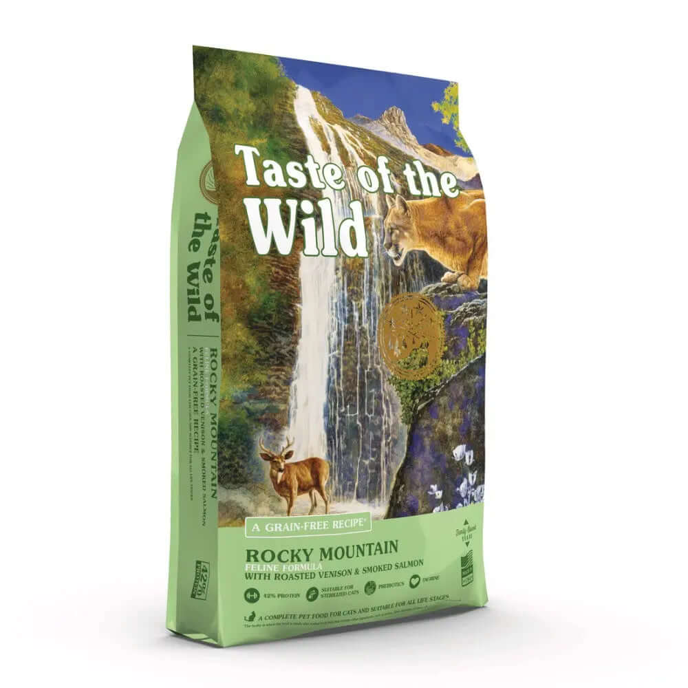 Taste of the Wild Feline Rocky Mountain Cat Food bag with roasted venison and smoked salmon background.
