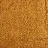 Close-up of fine yellow-brown textured material, possibly sand or granular substrate for aquariums.