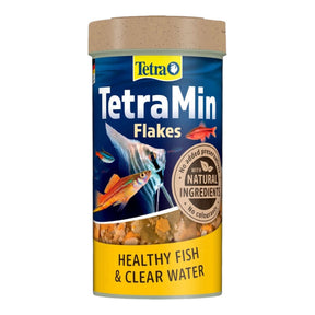 TetraMin Tropical Fish Flakes in a container, promoting healthy fish growth and vibrant colors with natural ingredients.