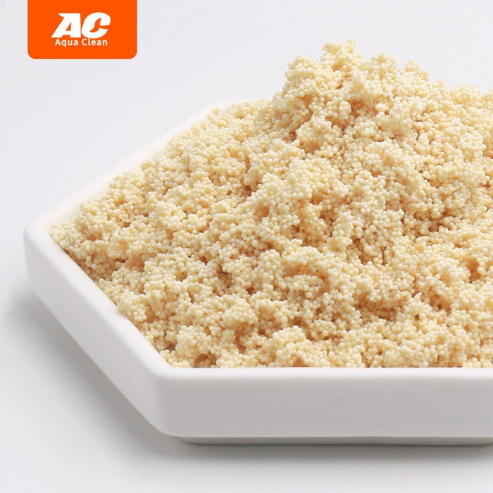 Aqua Clean Nitrate Remover granules in a dish, designed to reduce algae and nitrate levels in aquariums.