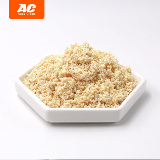 Aqua Clean Nitrate Remover granules in a white dish, showcasing effective algae prevention for aquariums.