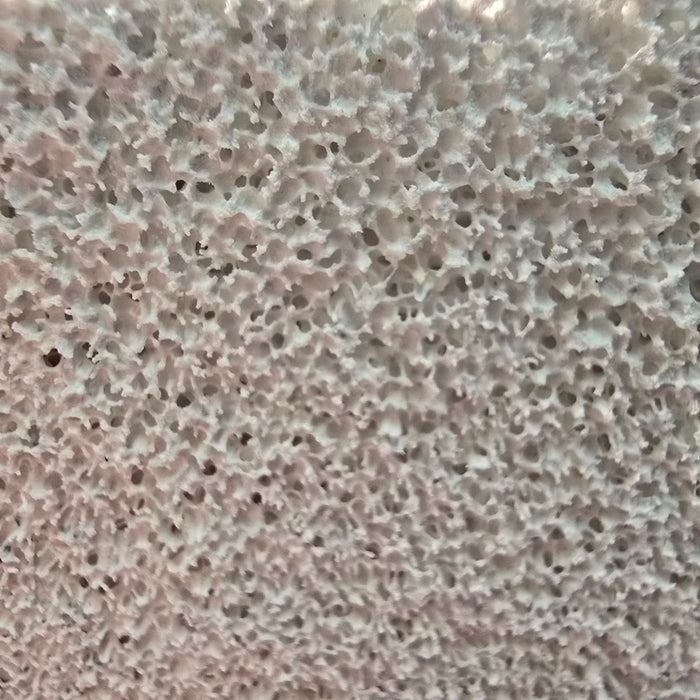 Close-up texture of Aqua Clean Red Cell Filter Media Brick showing its porous ceramic surface for optimal water filtration.