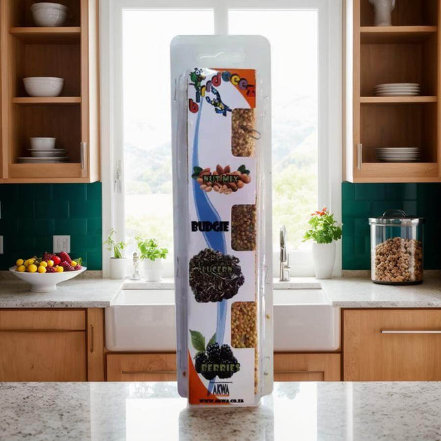 Budgie Treat Stick featuring nuts, lucerne, and berries, displayed in a bright kitchen setting.