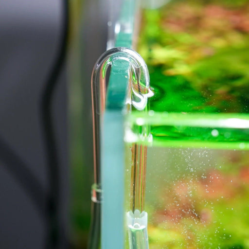 Chihiros U Clip showcasing a U-shaped acrylic tube attached to a fish tank, ideal for connecting CO2 diffuser hoses.