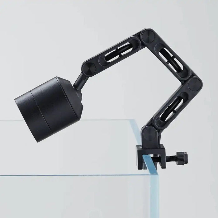 Compact Chihiros Z Light Tiny LED mounted on aquarium, featuring an adjustable arm for customizable lighting angles.