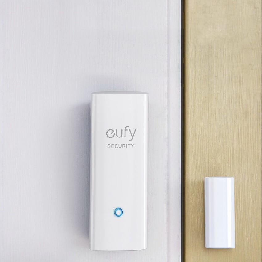 eufy Security Smart Entry Sensor installed on a door frame, featuring a compact design for monitoring doors and windows.
