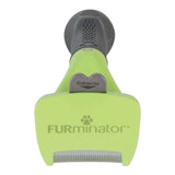 Furminator Dog DeShedding Tool with FURejector button for easy hair removal and stainless steel edge, green design.