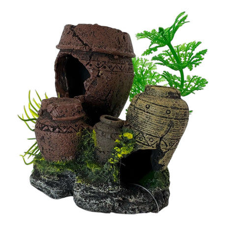 Aquarium ornament featuring decorative jars and vibrant plants on a rock formation, enhancing underwater aesthetics.