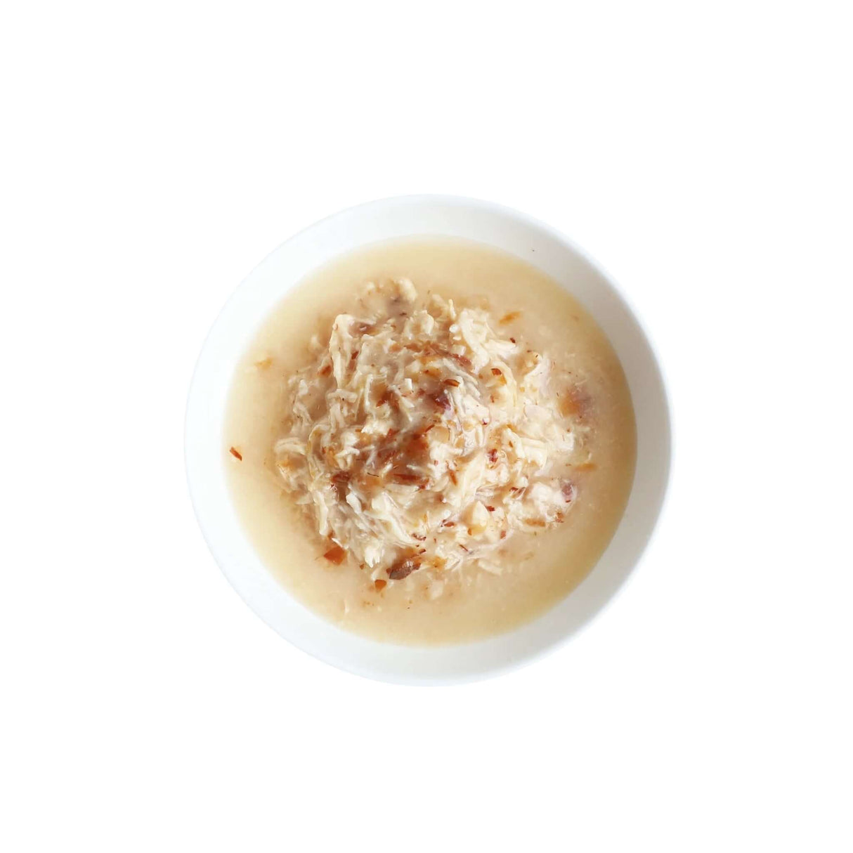 Kit Cat boneless chicken shreds and smoked fish flakes in a bowl, perfect for sensitive stomachs and grain-free diets.
