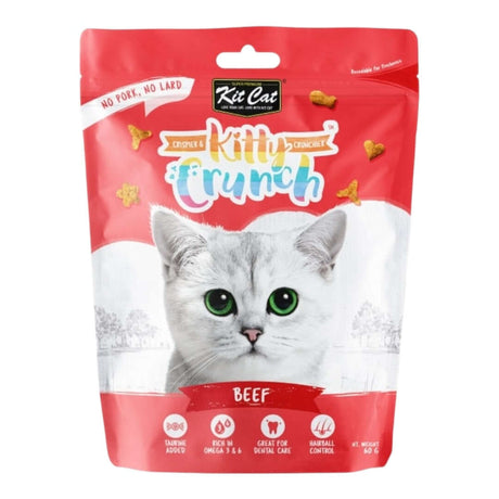 Kit Cat KittyCrunch cat treats in beef flavor, featuring a playful cat on the packaging, perfect for dental health.