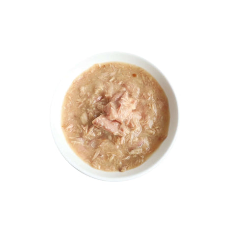 Bowl of Kit Cat White Meat Tuna Flakes and Salmon with Goat's Milk cat food, creamy texture for sensitive stomachs.