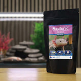 NT Labs AxoTonic Salt Mixture packaging designed for axolotls on display in an aquarium setting.