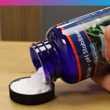 NT Labs Aquarium KH Up pH Stabiliser bottle pouring powder into lid for aquarium water treatment.