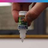 NT Labs Plastic Plant Cleaner bottle being held, ideal for cleaning aquarium plants and ornaments.