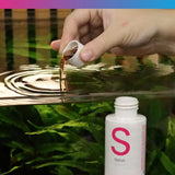 NT Labs Satus Filter Start being poured into an aquarium for accelerated tank maturing.