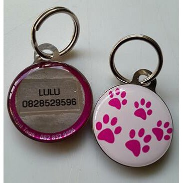 Custom Pet ID Tag with pink paw prints and contact info, perfect for pet identification and safety.