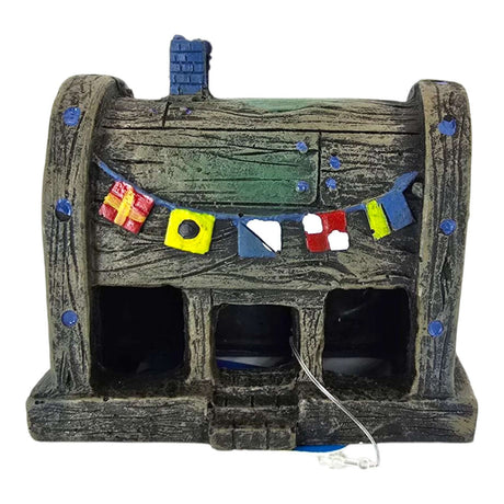 Pirates Booty Aquarium Ornament showcasing a rustic wooden barrel house with colorful nautical flags.
