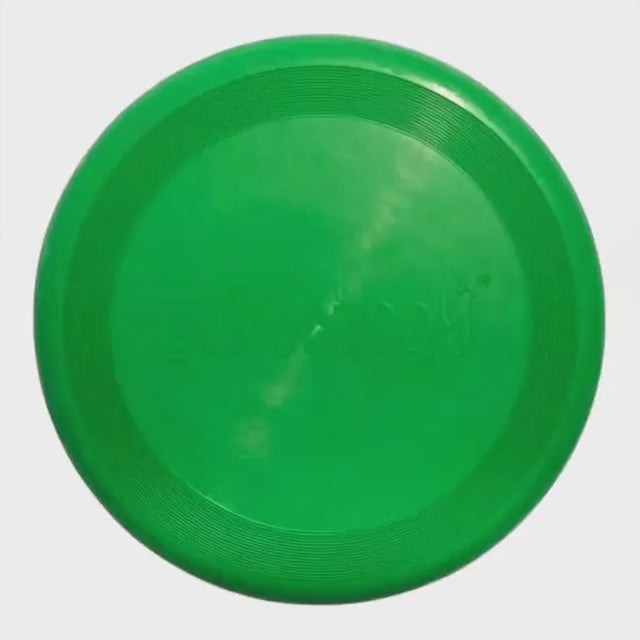 Playbuddy green rubber frisbee designed for optimal flight and outdoor fun with dogs.