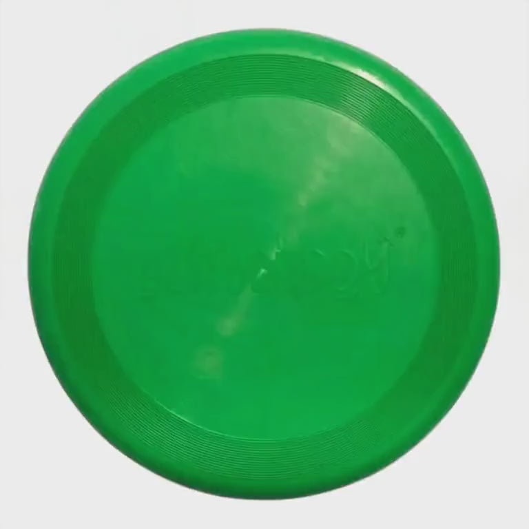 Playbuddy green rubber frisbee designed for optimal flight and outdoor fun with dogs.