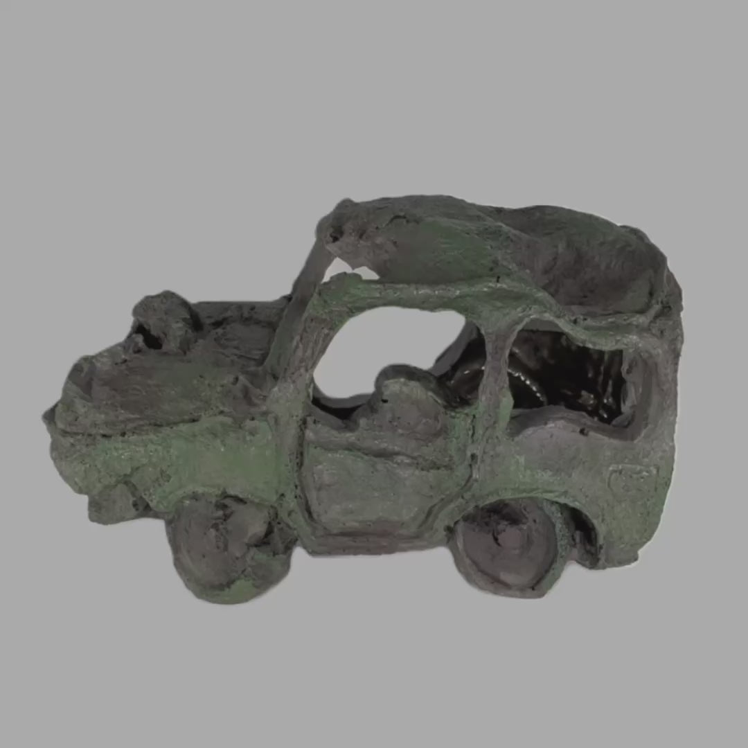 Car Wreck Aquarium Ornament in greenish-gray, showcasing intricate details of a rusted, weathered compact car.