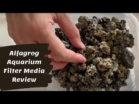 Hand demonstrating Alfagrog aquarium filter media, showcasing its porous texture for biological filtration.