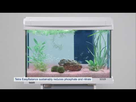 Tetra EasyBalance in a fish tank stabilizing water values, reducing nitrate and phosphate levels for healthier fish.