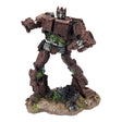 Red Transformer Ornament standing robot figure with weathered finish and mechanical detailing on a textured base.