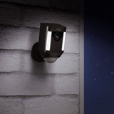 Ring Spotlight Battery Operated Security Camera mounted on a wall, providing smart home security with HD video and motion detection.