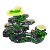 Rock with Bridge Aquarium Ornament featuring layered dark gray and black rocks with green moss accents.
