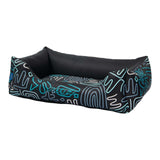 Rogz Graphix Walled Dog Bed in bold black design with colorful line patterns, perfect for stylish pet lounging.