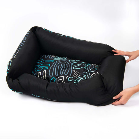Rogz Graphix Walled Dog Bed with bold patterns and durable fabric, perfect for stylish pet lounging.