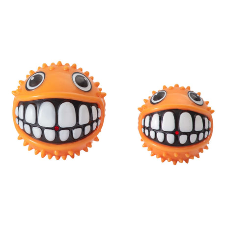 Rogz Grinz Fetch Puffer Fish Toy in orange, featuring a smiling face, perfect for playful dog fetch sessions.