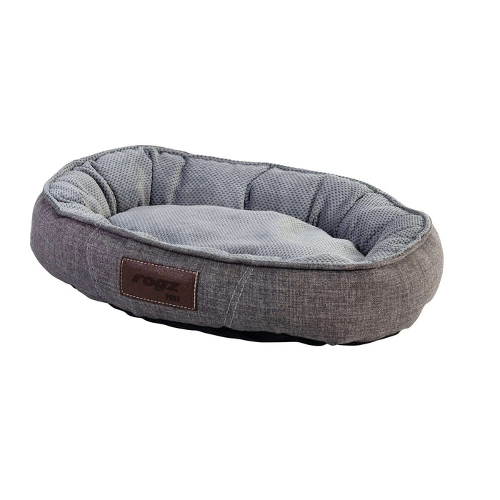 Rogz Lounge Oval pet bed in gray with soft cushioning, providing a cozy and secure resting spot for medium-sized pets.