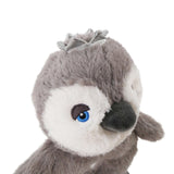 Close-up of a soft plush penguin toy with a gray body and a silver crown, perfect for interactive dog playtime.
