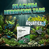 Seachem Herbivore Tabs 85g package displayed in an aquatic environment with plants and fish.