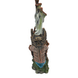 Seaguardian Shipwreck Ornament depicting a weathered ship with pale sails, ideal for aquarium decoration.