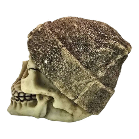Skull aquarium ornament with a cozy brown beanie, featuring intricate details and a weathered cream finish.