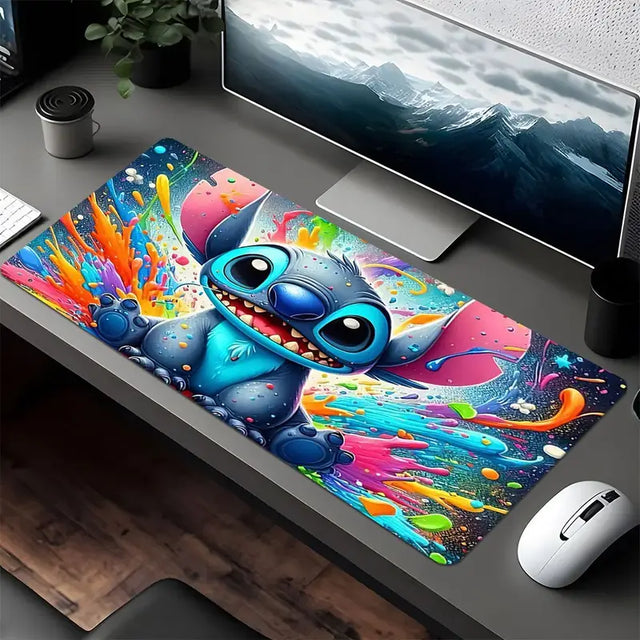 Vibrant Stitch mouse pad 80x40cm with colorful paint splatters enhancing the desk workspace decor.